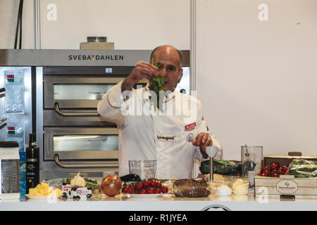 London UK 13 November 2018 Enzo Oliveri The Sicilian chef , For the past ﬁve years he’s been honing his skills as a sports nutritionist, working with the Italian National cycling team which he will continue to support every year. Doing a pasta cooking demonstration in the Pasta and Pizza show in London Olympia Credit: Paul Quezada-Neiman/Alamy Live News Stock Photo
