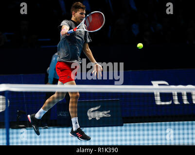 13th November 2018, O2 Arena, London, England; Nitto ATP Tennis Finals; Dominic Thiem (AUT) plays a backhand shot in his match against Roger Federer (SUI) Stock Photo