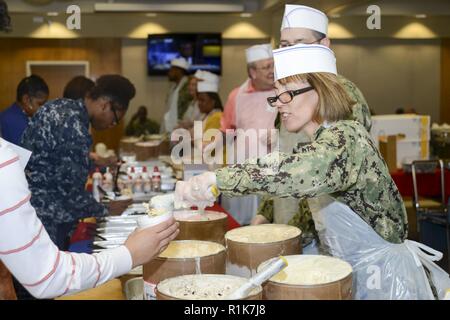 Capt. Carolyn Rice, NMCP's executive officer, serves ice cream to NMCP staff members during the Annual Customer Service Appreciation Week ice cream social. Stock Photo