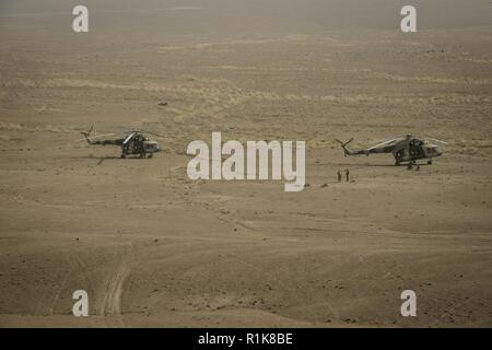 LOGAR, Afghanistan – Two Mi-17 helicopters from Special Mission Wing 777 prepare for afternoon training at a range in Logar province, Oct. 9, 2018. MD-530 “Little Bird” attack helicopters and A-29 Tuscano aircraft also participated in the training for Afghan Tactical Air Controllers assigned to one of Afghanistan’s special operations units. (NSOCC-A