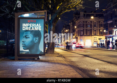 Netflix poster signing or lightbox outdoors in busstop Stock Photo