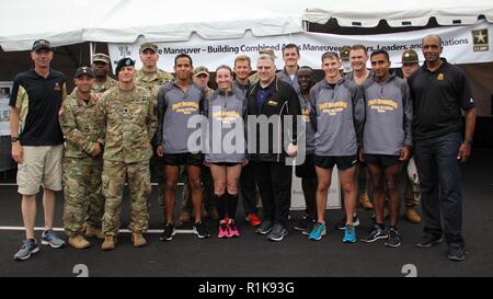 (Oct. 7, 2018) U.S. Army Chief of Staff Gen. Mark Milley, Maneuver Center of Excellence Commanding General Maj. Gen. Gary Brito and U.S. Army Armor School Commandant Brig. Gen. David Lesperance pose with the Fort Benning MCoE running team at the Army Ten-Miler in Washington D.C. The team placed first in the active duty mixed team category. Stock Photo