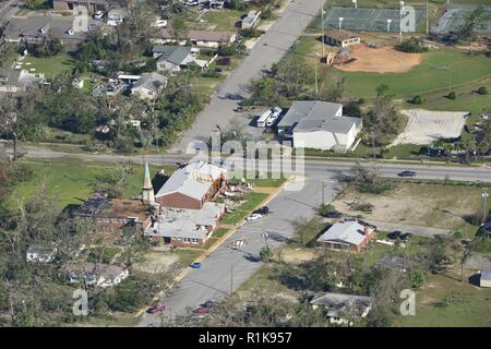 An HC-144 Ocean Sentry aircrew from Coast Guard Aviation Training Center Mobile conducted an over-flight of the aftermath of Hurricane Michael, Oct. 11, 2018. After a storm passes, the Coast Guard focuses on saving lives in the impacted area; the Coast Guard also responds to oil and hazardous material threats post-storm landfall. Stock Photo