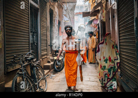 Varanasi, India - November 23, 2017 : Hindu perform worship ceremony at Bangali Tola old street Stock Photo