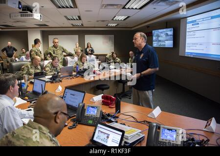 Steven Burton, emergency management specialists, briefs members of the Emergency Operations Center during the 2018 San Antonio Mass Casualty Exercise and Evaluation at Brooke Army Medical Center, Fort Sam Houston, Texas, Oct. 11, 2018. The exercise simulated an active shooter scenario to test the capabilities of hospitals and emergency responders in the San Antonio area. ( Stock Photo