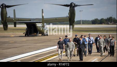 Brig. Gen. Anthony Genatempo, Air Force Life Cycle Management Center commander and Congressman Matt Gaetz, 1st District of Florida, walk out to welcome President Donald J. Trump on the flightline Oct. 15 at Eglin Air Force Base, Fla. Trump stopped at Eglin on his way to Panama City to see the devastation from Hurricane Michael.  The President exited Air Force One, met with Florida and base leadership, as well as the media before departing to the east on his helicopter. Stock Photo