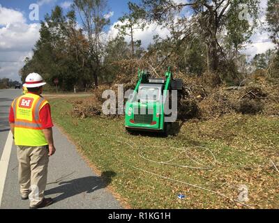 The U.S. Army Corps of Engineers is executing FEMA Mission Assignments following Hurricane Michael including one for Debris Technical Assistance and Route Clearance in Florida. In Snead today, crews were working to clear debris to make room to put poles back up to restore power. “We’re working with the power company here to clear rights of way so their crews can work to restore power to these communities here, replacing power poles and lines,” said Santiago Rosales who deployed to Florida from the Fort Worth District to help with storm response. “It’s rewarding work. We’re helping our communit Stock Photo
