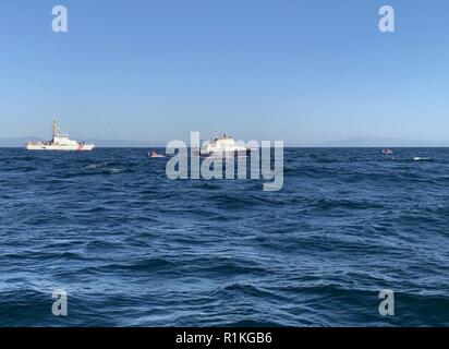 Coast Guard Cutter Hawksbill, an 87-foot Coastal Patrol Boat homeported in Monterey, California, assists NOAA personnel with the disentanglement of a whale three miles southwest of Santa Cruz, Oct. 15, 2018. NOAA requested assistance from the Coast Guard to locate the whale and to enforce a safety zone to keep vessels away from the whale during the disentanglement. Stock Photo