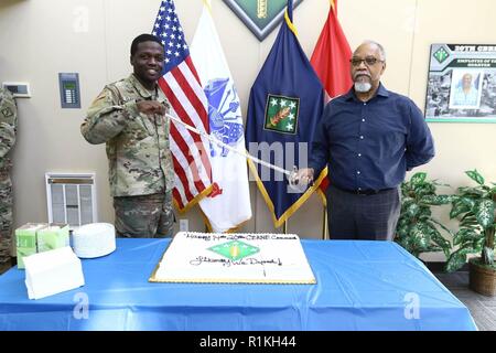 Soldiers, Department of the Army civilians, and contractors with the 20th Chemical, Biological, Radiological, Nuclear, Explosives (CBRNE) Command celebrated their last anniversary on APG South Oct. 16.  The 20th CBRNE Chief of Staff, Col. Adam Hilburgh, a New York native,  was joined by Pfc. Cameron Clayton, from West Palm Beach, Florida, and Jef Harris, from Bel Air, Maryland, during the ceremonial cutting of the cake at the 14th, and final, birthday celebration on APG South for the 20th CBRNE Command. Clayton, from the communications support team, arrived at the command in February 2018 whil Stock Photo