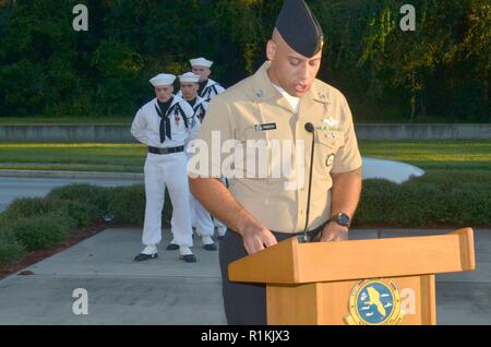 JACKSONVILLE, Fla. (Oct. 12, 2018) – Hospital Corpsman 1st Class Marcus Preston, Naval Hospital Jacksonville’s command career counselor, conducts an award ceremony at Naval Hospital Jacksonville. Preston, a native of Lake Havasu City, Arizona, says “The opportunity to assist sailors in achieving their professional and personal goals serves as a reminder every day why I joined the Navy.  We have a very motivated group of young sailors who want to excel and being a key player in that success is a great responsibility I perform with pride every day. Their success is our success!” Stock Photo