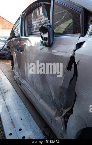 written off crash damaged citroen c4 car on a recovery trailer Stock Photo