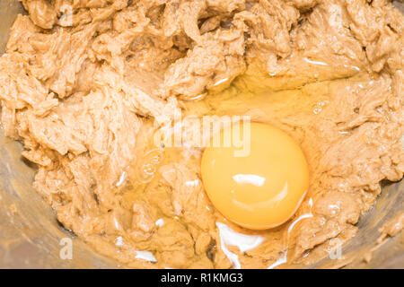 split or curdled cake batter mix when eggs added to creamed brown sugar and butter Stock Photo