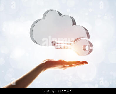 Cloud computing concept with glass symbol shown in hand Stock Photo