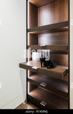 Wooden shelving in dressing room Stock Photo