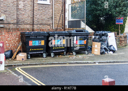 Overflowing recycling bins and dumped rubbish in Islington, London, UK Stock Photo