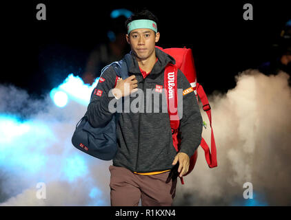 Kei Nishikori makes his way to centre court during day three of the Nitto ATP Finals at The O2 Arena, London. PRESS ASSOCIATION Photo. Picture date: Tuesday November 13, 2018. See PA story TENNIS London. Photo credit should read: Adam Davy/PA Wire. RESTRICTIONS: Editorial use only, No commercial use without prior permission. Stock Photo