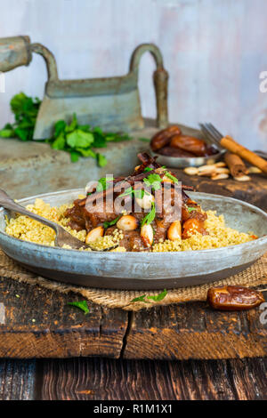 Chicken, date and honey tajine with couscous Stock Photo
