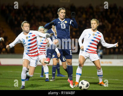 ScotlandÕs Jane Ross has a shot on goal past USA's Emily Sonnett (left) and Abby Dahlkemper (right) during the International Friendly match at the Simple Digital Arena, Paisley. Stock Photo