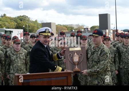 Groton, Conn. (Oct. 20, 2018) Vice. Adm. Charles 'Chas' Richard, Commander, Submarine Forces, presents the 2017 Battenberg Cup Award on behalf of Adm. Chris Grady, Commander, U.S. Fleet Forces, to Cmdr. Matthew Fanning, commanding officer of  the Los-Angeles class fast-attack submarine USS Hartford (SSN 768), and his crew during the 2017 Battenberg Cup Award presentation ceremony. The Battenberg Cup is presented annually to the best all-around ship or submarine in the Atlantic Fleet on the amassing of the crew's success. Stock Photo