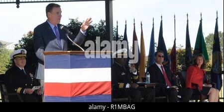 DAHLGREN, Va. (Oct. 19, 2018) – U.S. Senator Mark Warner lists a series of Dahlgren achievements from World War II long guns to global positioning system technology while speaking to the military and civilian audience gathered to celebrate the Naval Surface Warfare Center Dahlgren Division centennial. “This is an installation where a great deal of innovation and collaboration take place,” said Warner. “We’re going to need that same level of collaboration, cutting edge experimentation as we move forward for the next 100 years, not only to protect our country but to make sure that we’re able to  Stock Photo