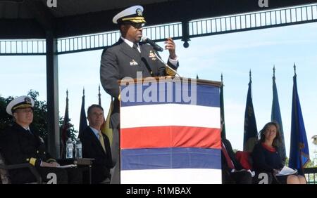 DAHLGREN, Va. (Oct. 19, 2018) – Naval Surface Warfare Center Dahlgren Division (NSWCDD) Commanding Officer Capt. Godfrey ‘Gus’ Weekes recounts the highlights of Dahlgren’s history before the military and civilian audience gathered to celebrate the NSWCDD centennial. “The men and women of Dahlgren are dedicated to the mission and have always answered the bell,” said Weekes, recounting the technological impact NSWCDD has made to the Navy and nation “We answered the bell in 1918 and we’re answering the bell today. Just like during the Cold War or the Korean War, we’re up against near peer or peer Stock Photo