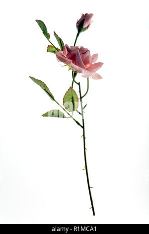 Red Rose Colouring In Close up of a single artificial red rose flower hanging against a soft ...