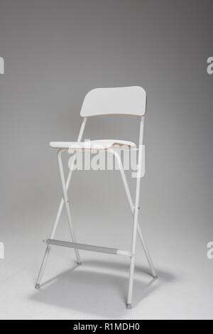 An Empty white chair in a studio. Stock Photo