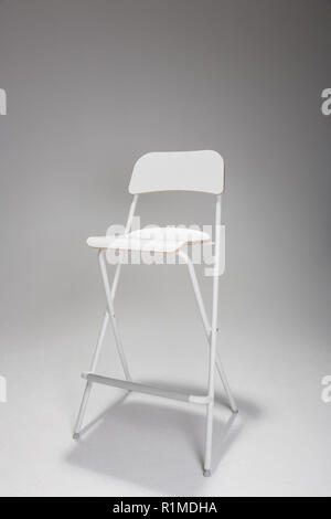 An Empty white chair in a studio. Stock Photo