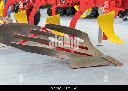 Corn harvester head with several silver blades. Agricultural machinery for soil cultivation Stock Photo