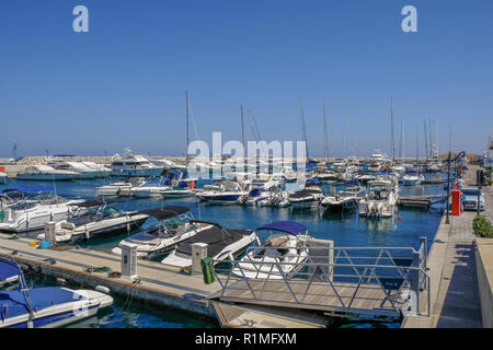 Marina, Limassol, Cyprus - June 29, 2018: View of the marina with yachts, motor boats and cruisers moored in formation.  Taken on a bright sunny summe Stock Photo