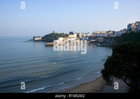 UK, Wales, Pembrokeshire, colourful buildings surround the harbour in evening sunshine at Tenby Stock Photo