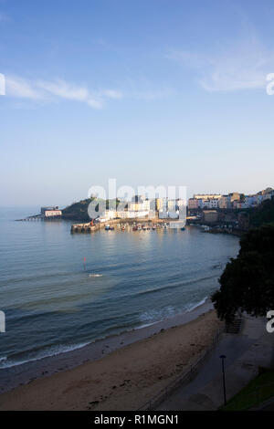 UK, Wales, Pembrokeshire, colourful buildings surround the harbour in evening sunshine at Tenby Stock Photo