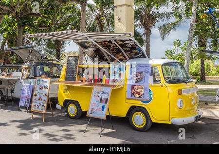 Food truck in a classic yellow volkswagen van at the Garuda Wisnu Kencana Cultural Park Stock Photo