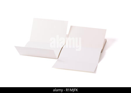 Opened two lying white books on a white surface in the center. Unusual layout. Foreshorten. Stock Photo