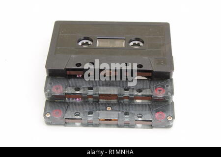 Three magnetic cassette tapes stacked on white background Stock Photo