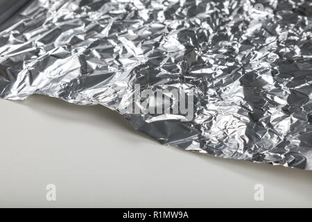 Aluminum foil roll for background, close up. Stock Photo