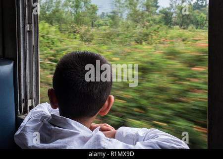 The first in a lifetime journey by train of a seven-year-old boy from India. June 2018 Stock Photo