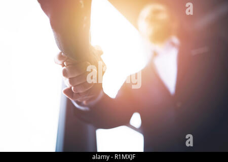 Handshaking business person in the office with network effect. concept of teamwork and partnership Stock Photo