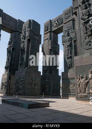 The Chronicle of Georgia is a monument that shows the life of Jesus Christ at the bottom of the pillars and Georgian Kings and Queens at the top. It's Stock Photo