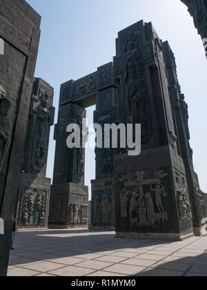 The Chronicle of Georgia is a monument that shows the life of Jesus Christ at the bottom of the pillars and Georgian Kings and Queens at the top. It's Stock Photo