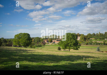 A view of the village of Ewelme, Oxfordshire with its village school and almshouses bathed in afternoon Summer sunshine. Stock Photo