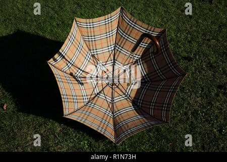 Burberry's Nova Check Umbrella Showing Spokes and Tassel on Handle Stock Photo