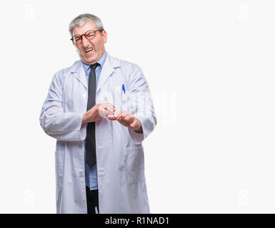 Handsome senior doctor, scientist professional man wearing white coat over isolated background disgusted expression, displeased and fearful doing disg Stock Photo