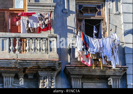 Hanging clothes out to dry on a balcony in Havana Cuba Stock Photo