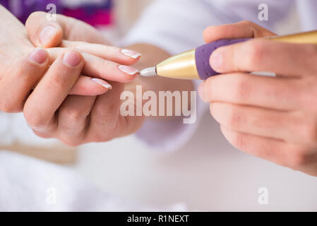 Hands during manicure care session Stock Photo