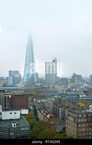 London, UK - 30th October 2016: Looking across London rooftops towards The Shard on a misty autumn day Stock Photo