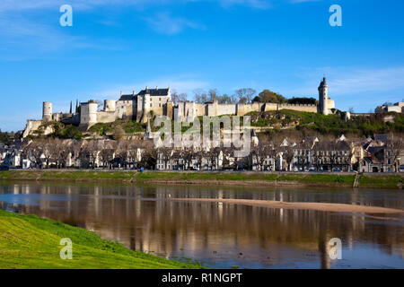 Chinon town and chateau on the hill above by the banks of the Vienne River in spring sunshine, Indre-et-Loire, France Stock Photo