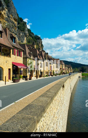 La Roque-Gageac, France -  3rd April 2017: The honeypot village of La Roque-Gageac is built under the cliffs beside the Dordogne River in Dordogne, Nouvelle Aquitaine, France. It is a member of the Les Plus Beaux Villages de France ('The most beautiful villages of France') association. Stock Photo