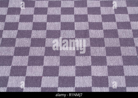Checkered tablecloth texture as a background, closeup picture. Stock Photo