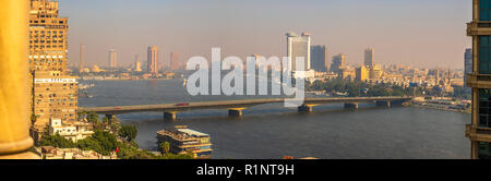 Cairo University Bridge over the River Nile from Giza to Cairo, Egypt, views of downtown skyscrapers and Hyatt Grand Nile Tower revolving restaurant Stock Photo